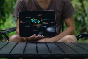 EcoFriendly Energy Sources Display on Tablet Screen in Outdoor Setting